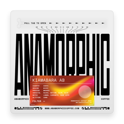 Anamorphic coffee package with black text and an orange label on a white background