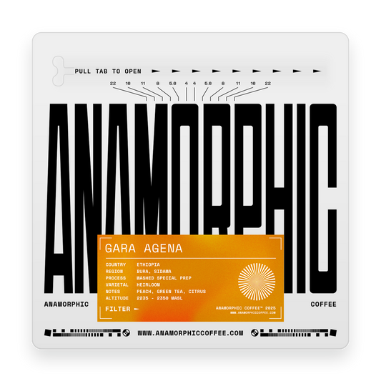 Anamorphic coffee packaging with black text and an orange label on a white background